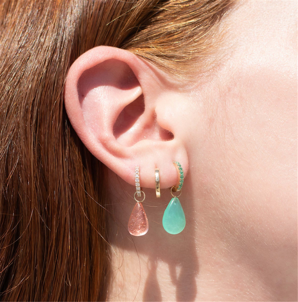 model wearing 3 huggy earrings