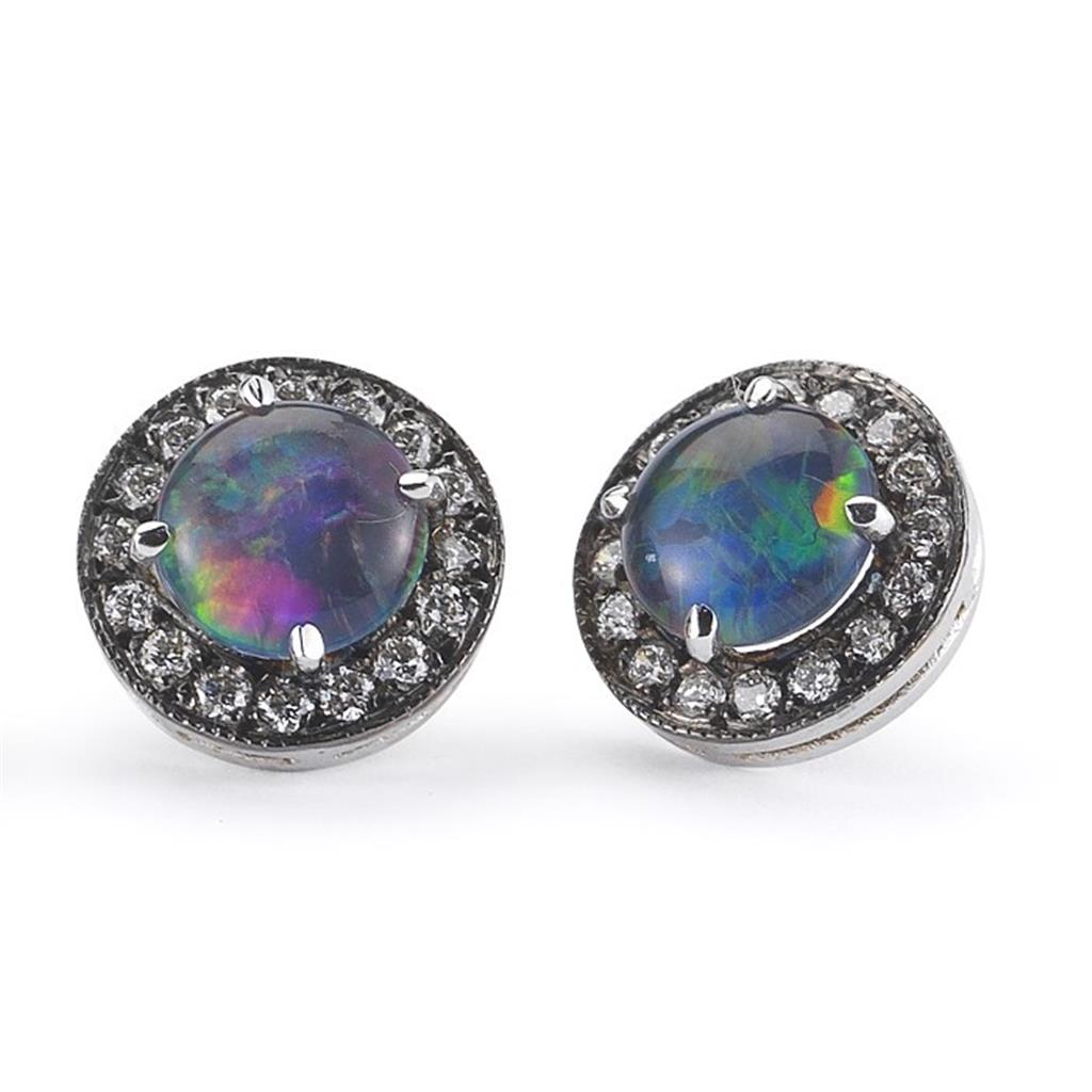 colored stoen earrings with surrounding diamonds
