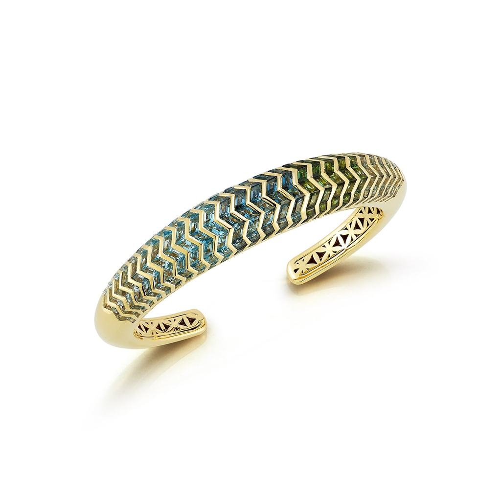 Cuff bracelet with gold and blue shaded gems in zigzag pattern
