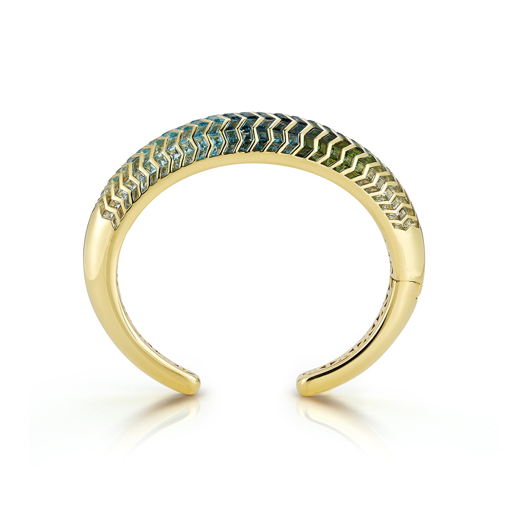 Cuff bracelet with gold and blue shaded gems in zigzag pattern