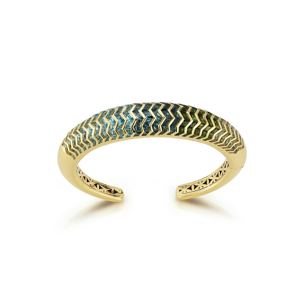 Cuff bracelet with gold and blue shaded gems in zigzag pattern