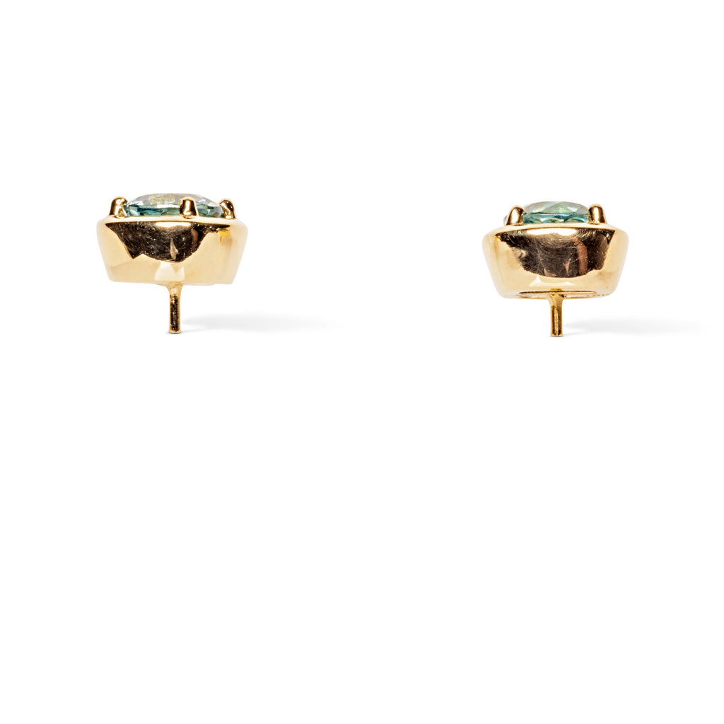 side view of gold and blue zircon studs
