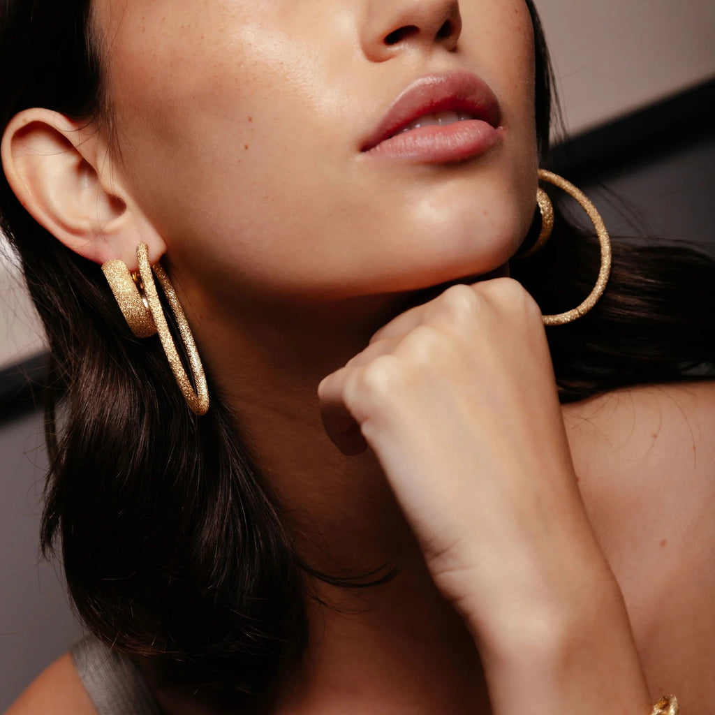 model wearing florentine finish gold hoop earrings