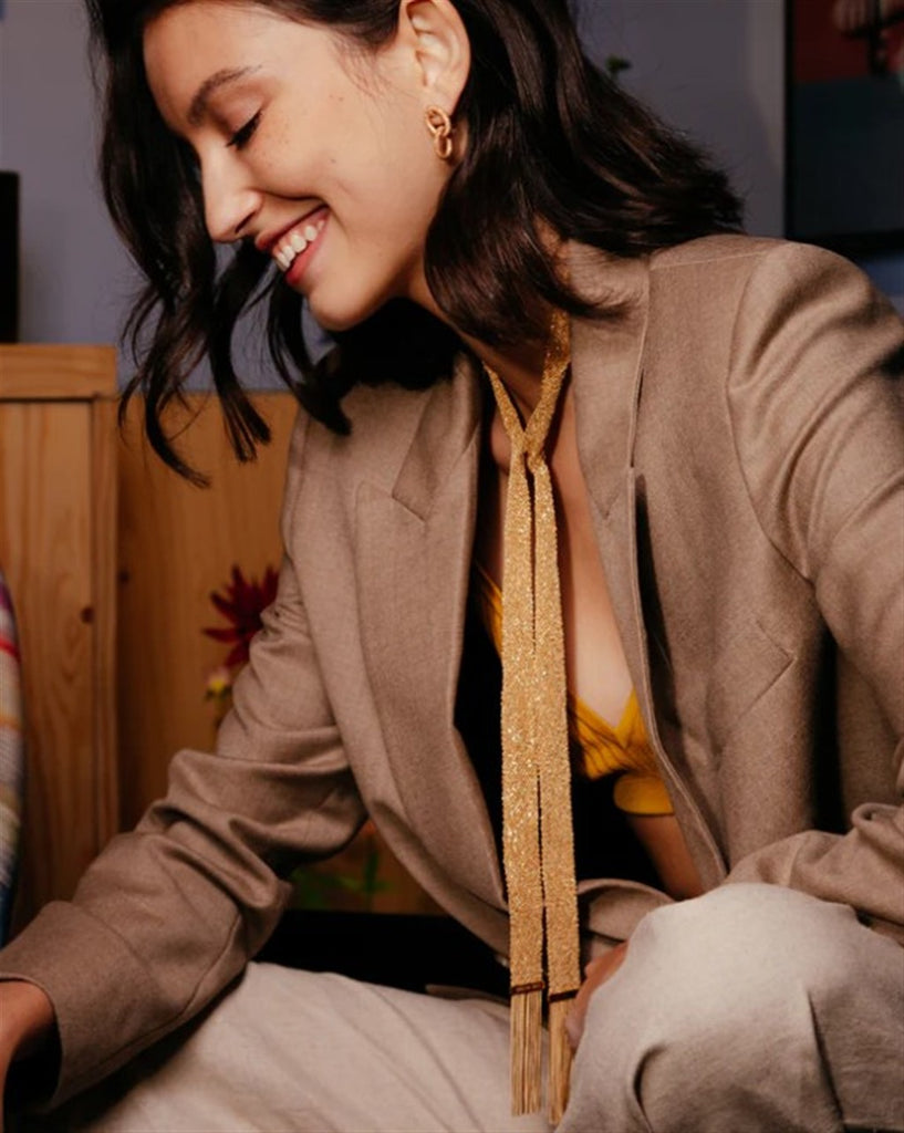 woven scarf gold on neck
