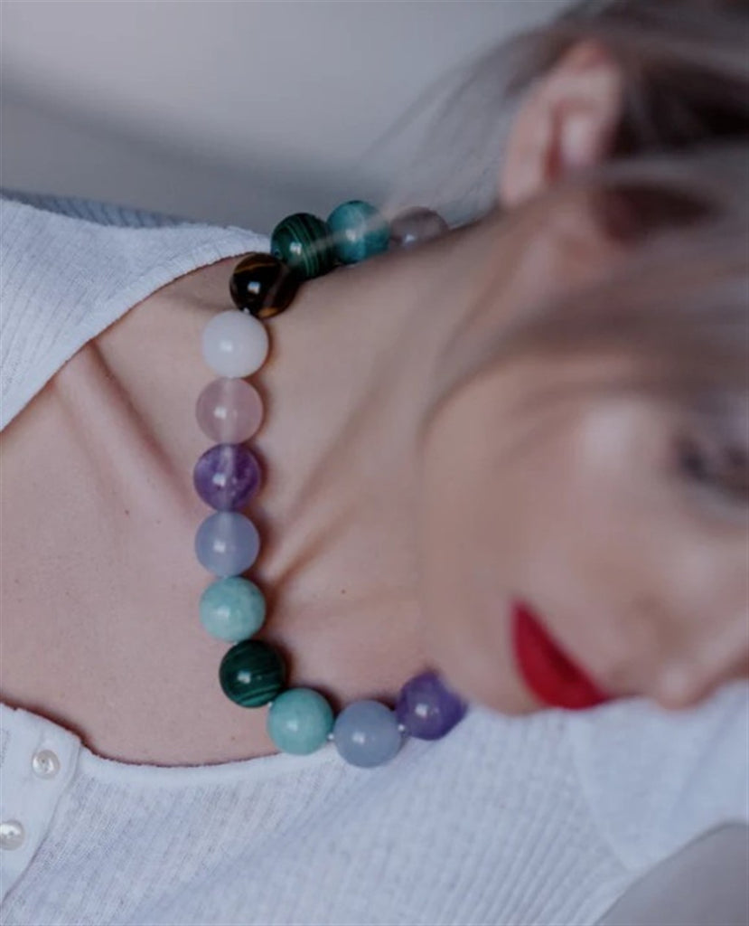 model wearing beaded necklace