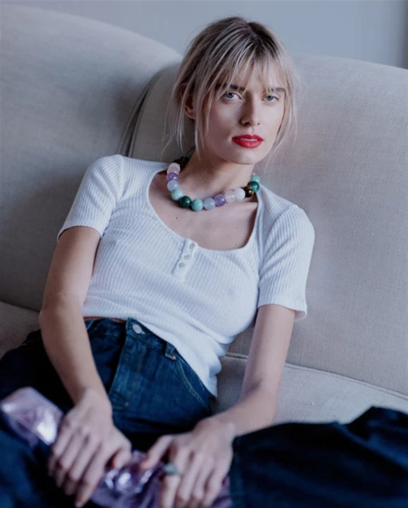 model wearing beaded necklace 