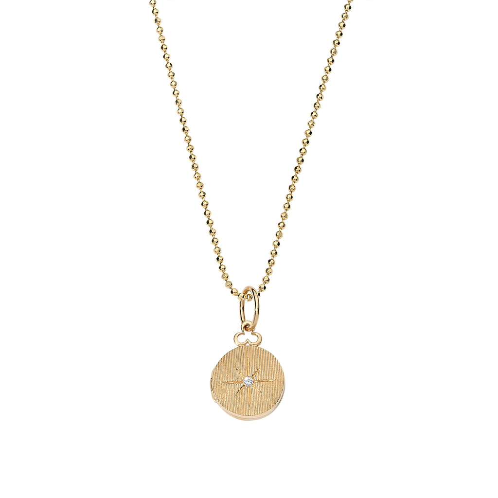 gold round star locket on necklace