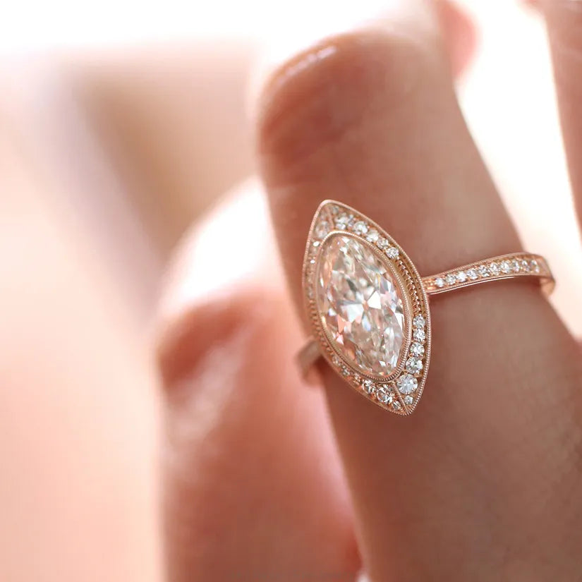 rose gold oval shaped diamond halo on model