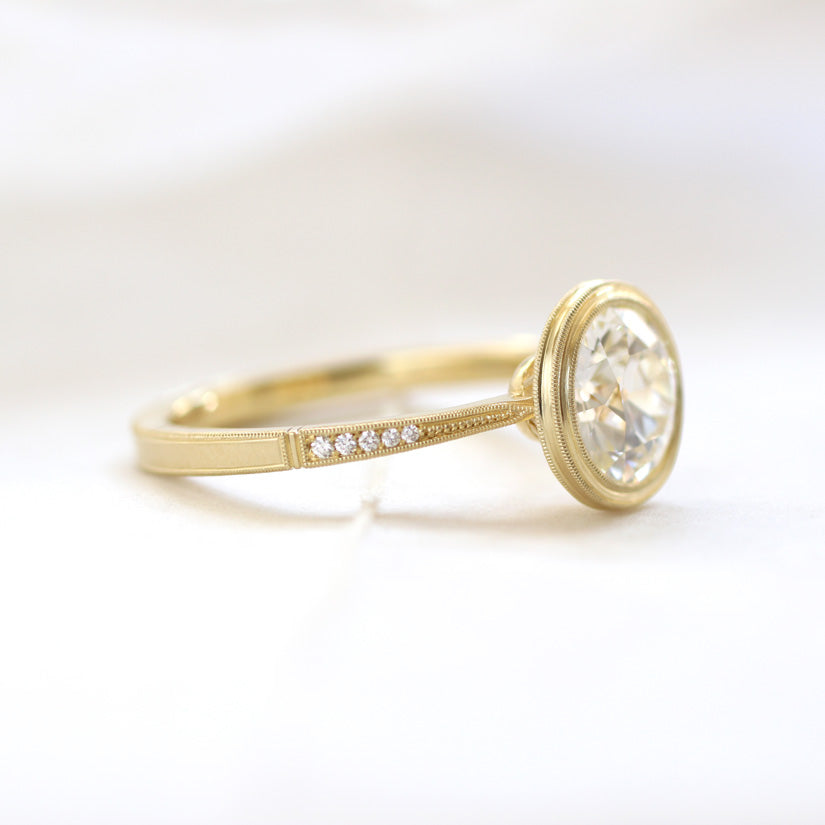 side view of bezel diamond ring