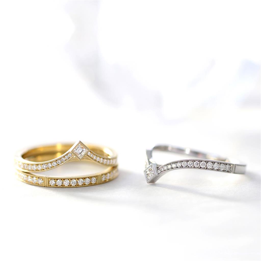 gold and diamond wedding band with point