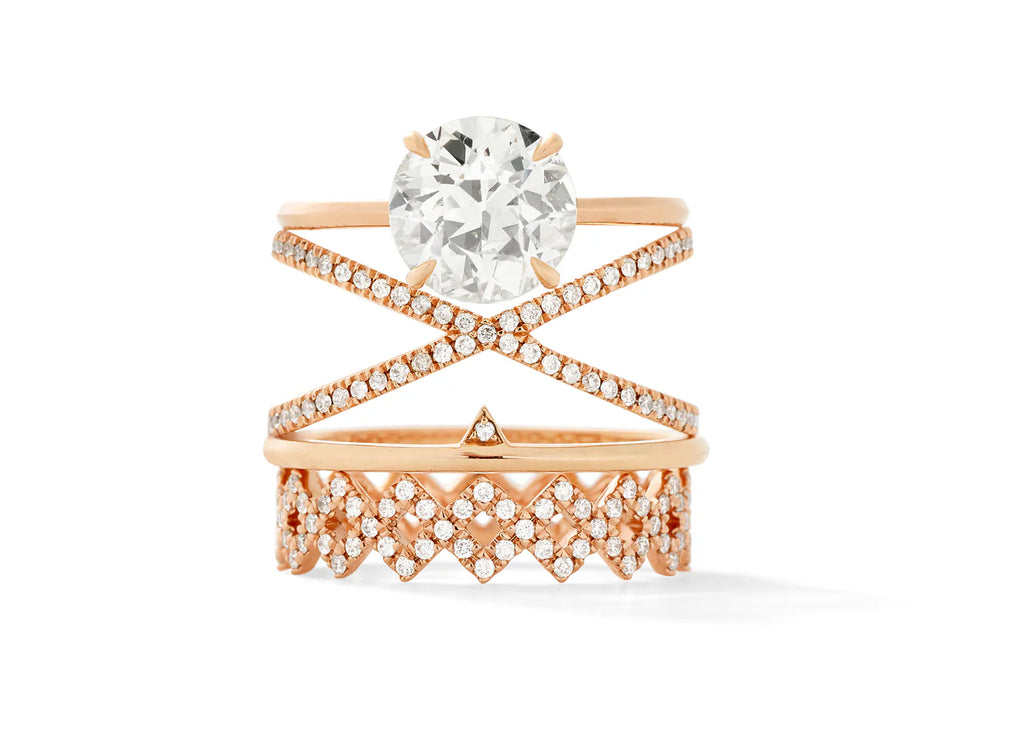 round solitaire diamond ring stached on diamond and gold wedding bands