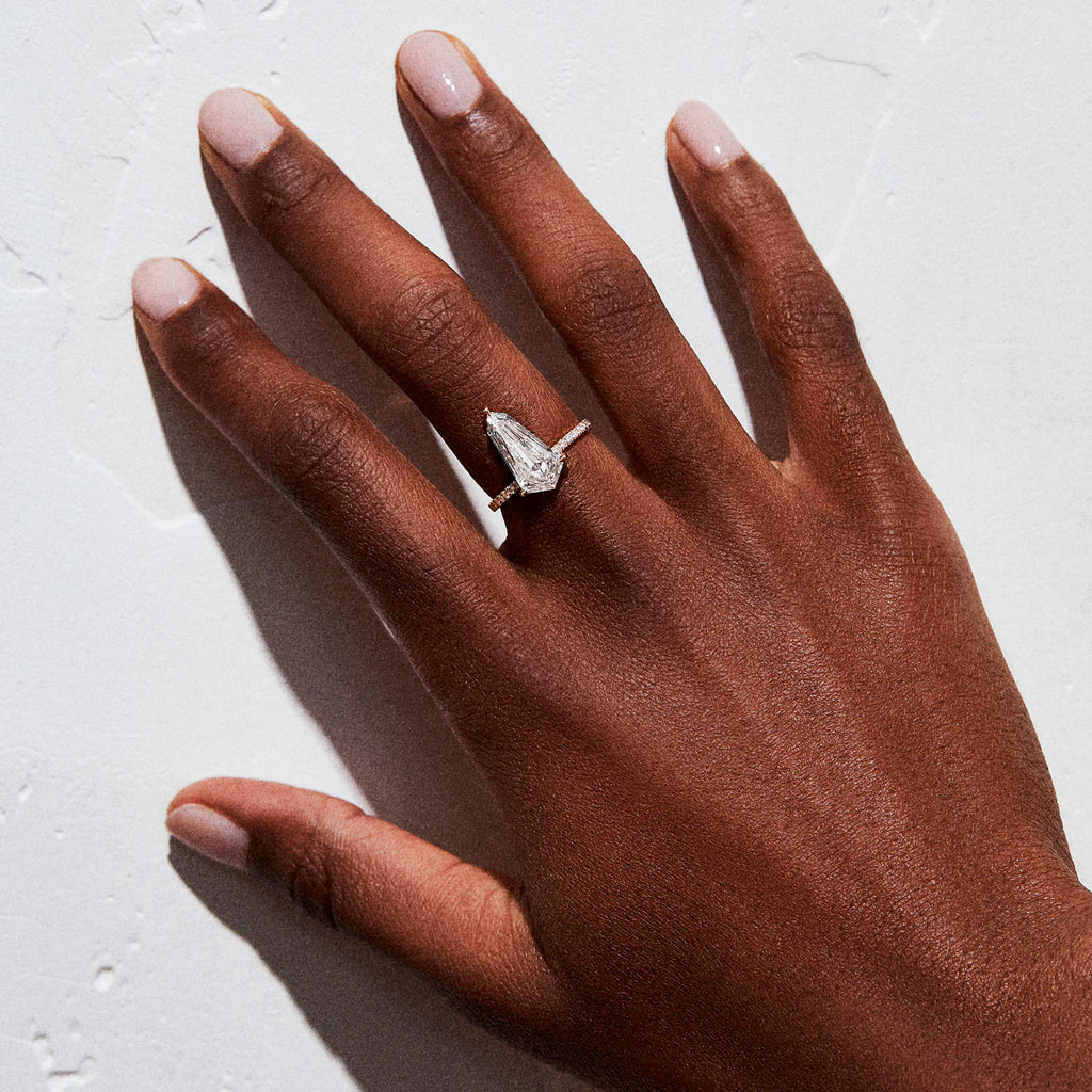 model wearing elongated kite shaped diamond ring