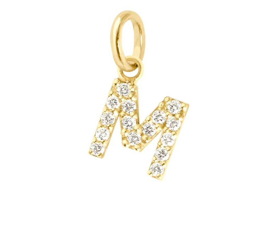 gold and diamond pendant in shape of letter M