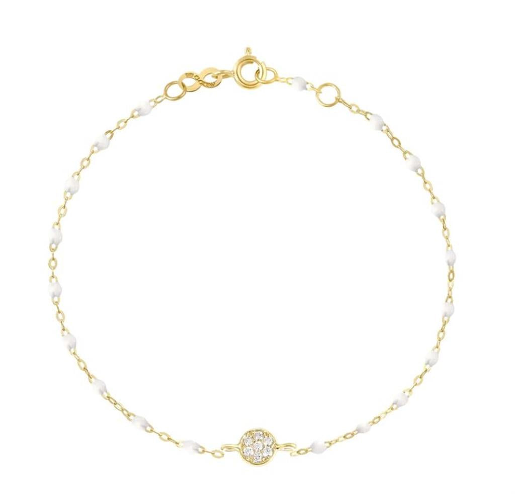 dainty gold bracelet with white beads and pave diamonds in center
