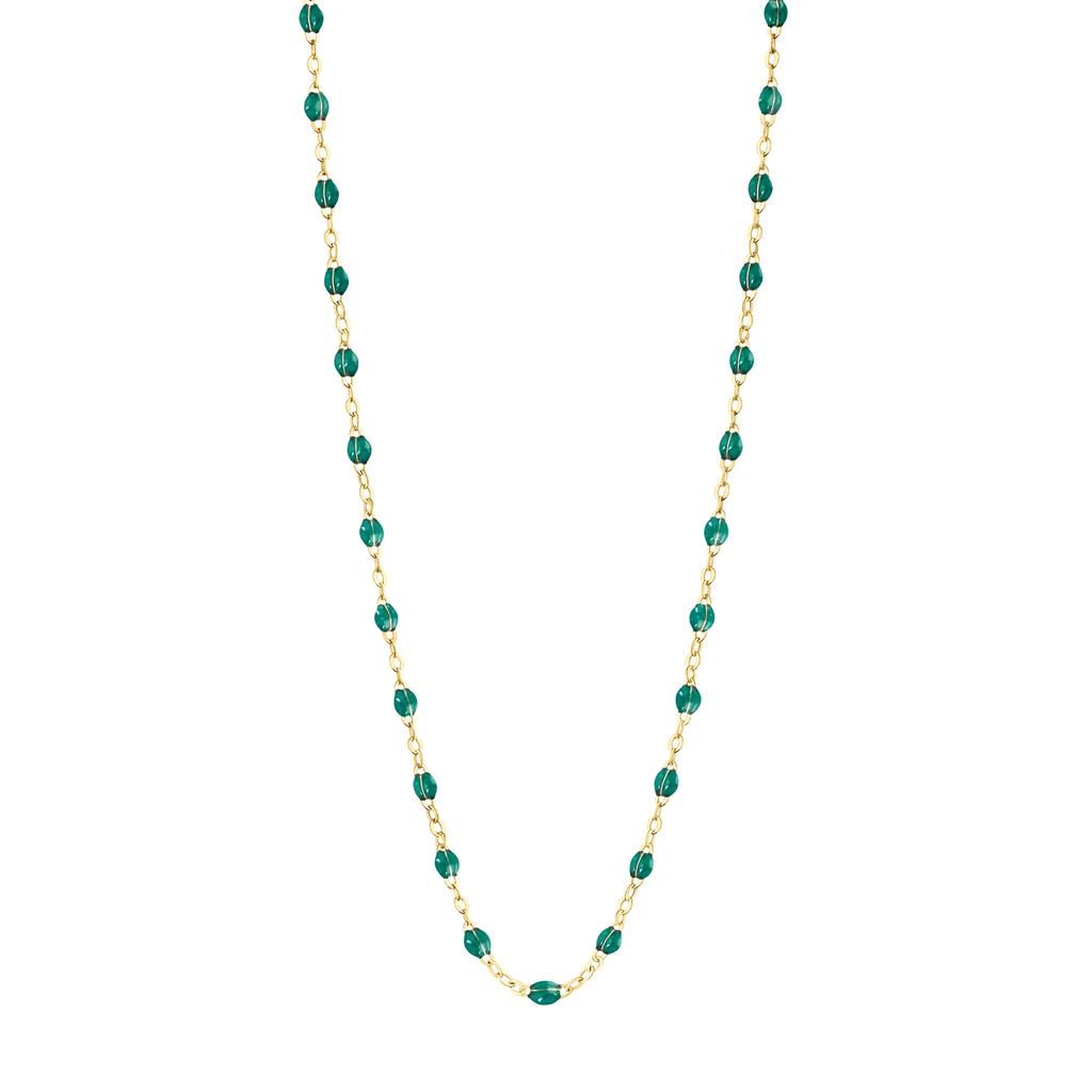dainty gold necklace with emerald colored beads