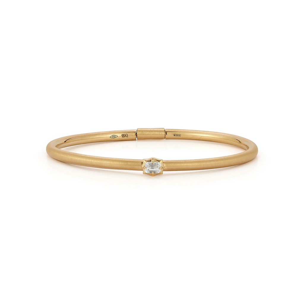 gold bangle bracelet with single diamond in center