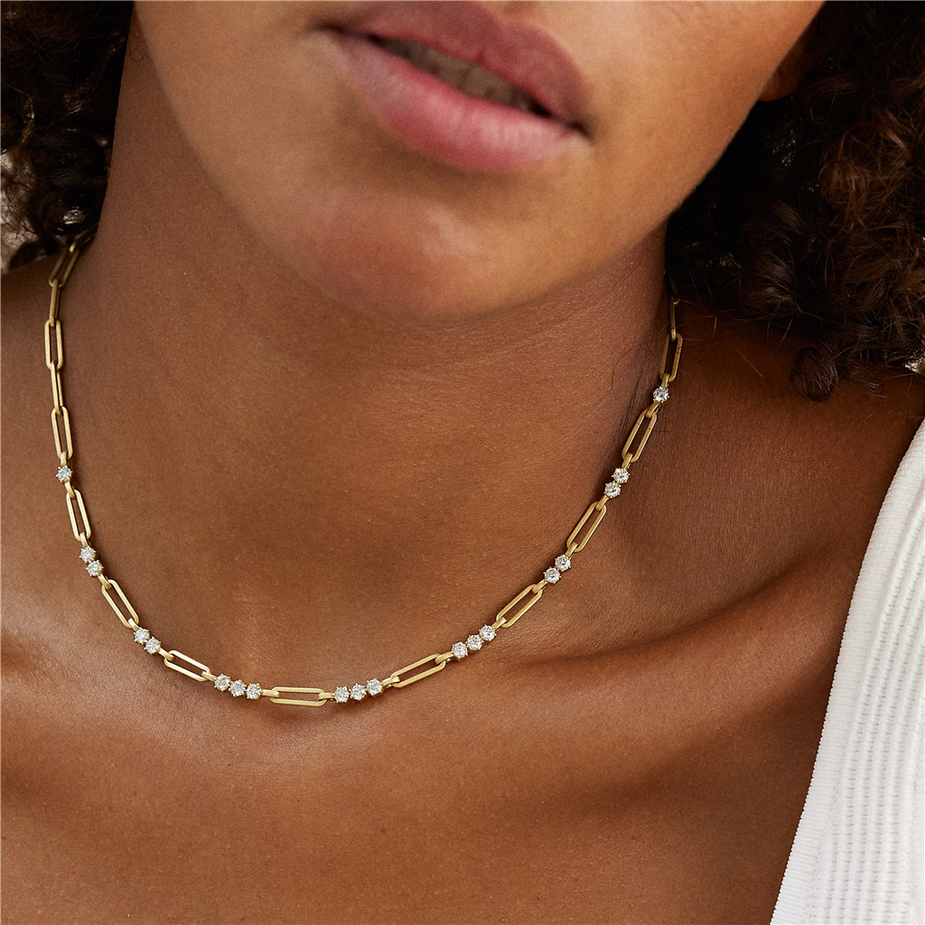 model wearing gold and diamond chain link necklace