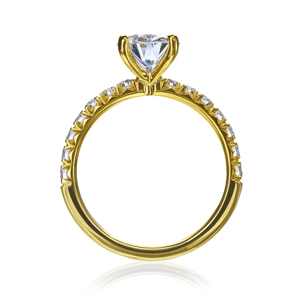 side view of gold solitaire ring