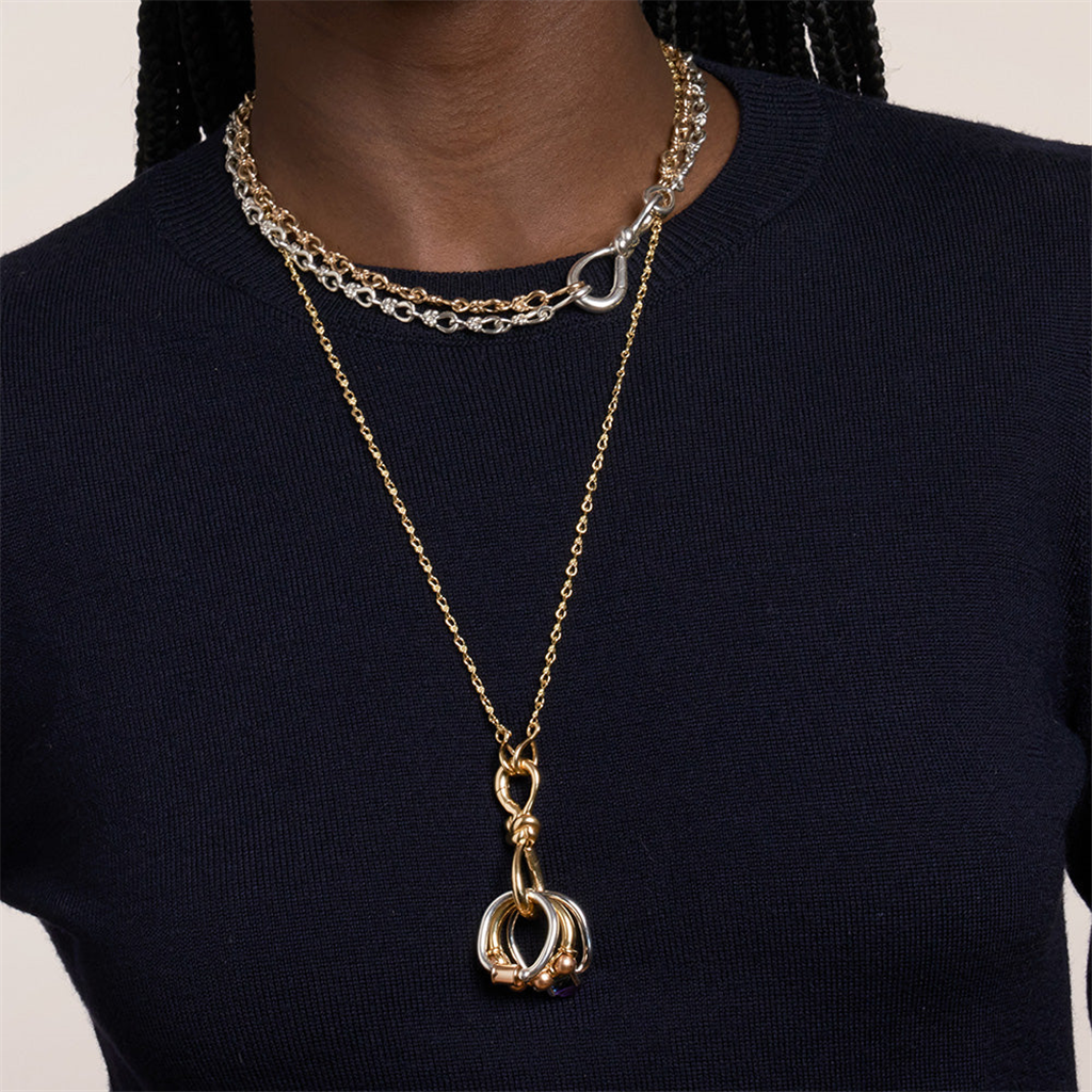 Gold knot chain necklace on model