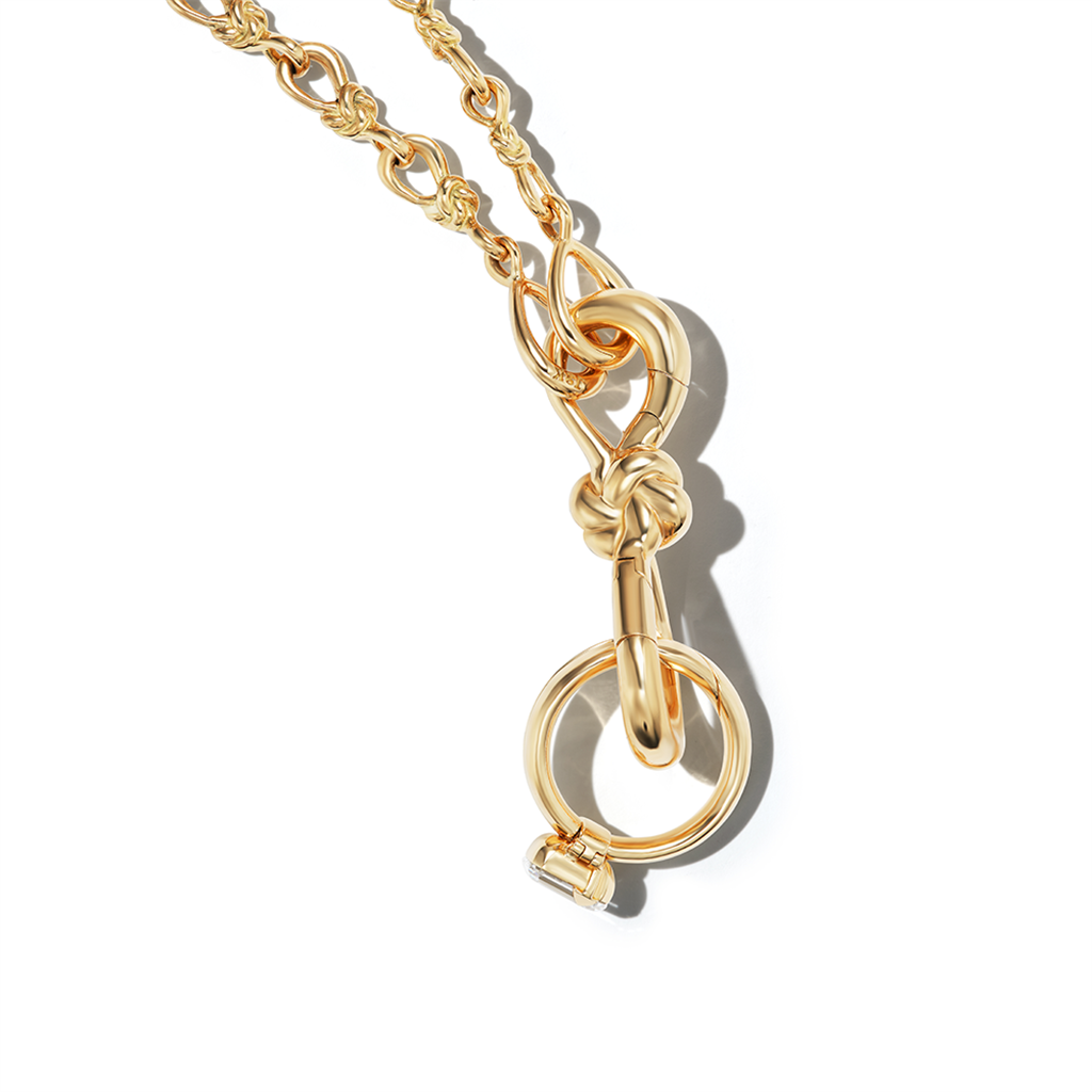 gold know lock on chain with charm
