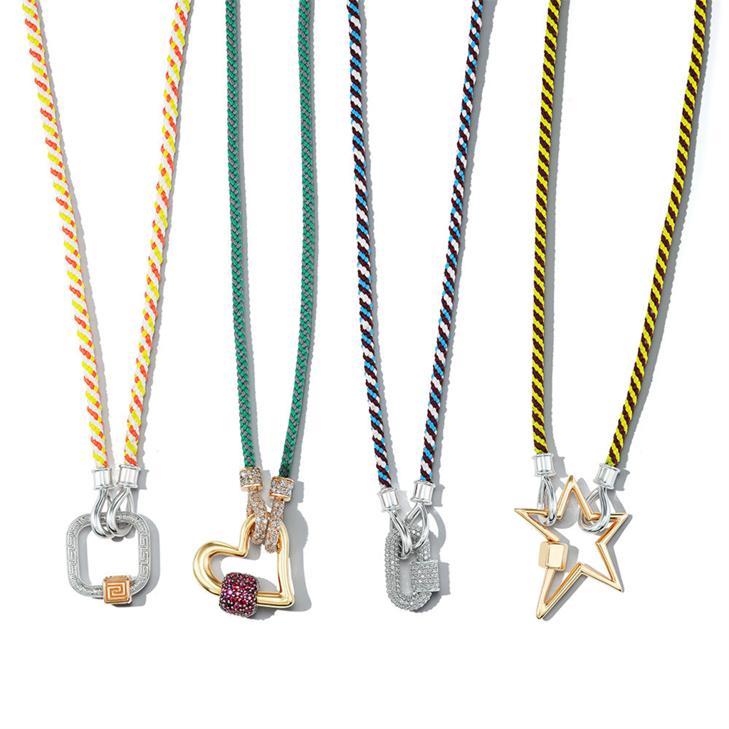 4 string necklaces shown with varying gold and silver charms