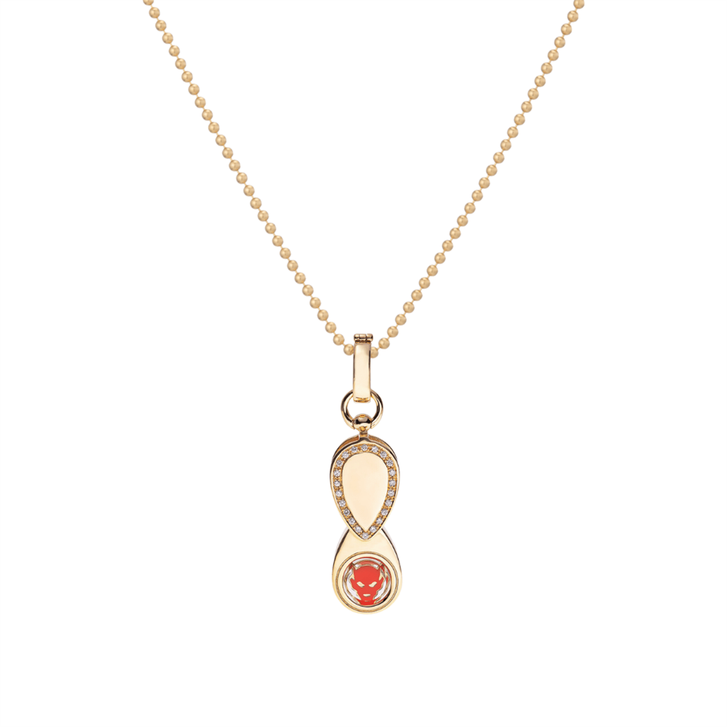 gold and diamond charm on necklace