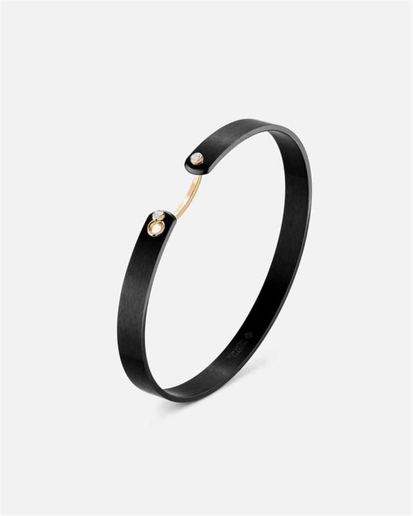 Black titanium and yellow gold bangle bracelet