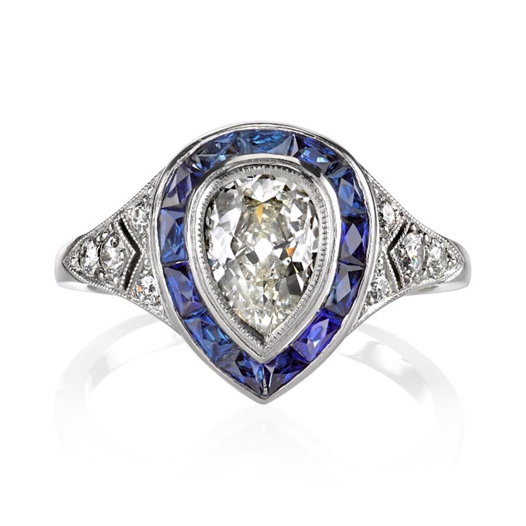 Pear shaped diamond ring with sapphires