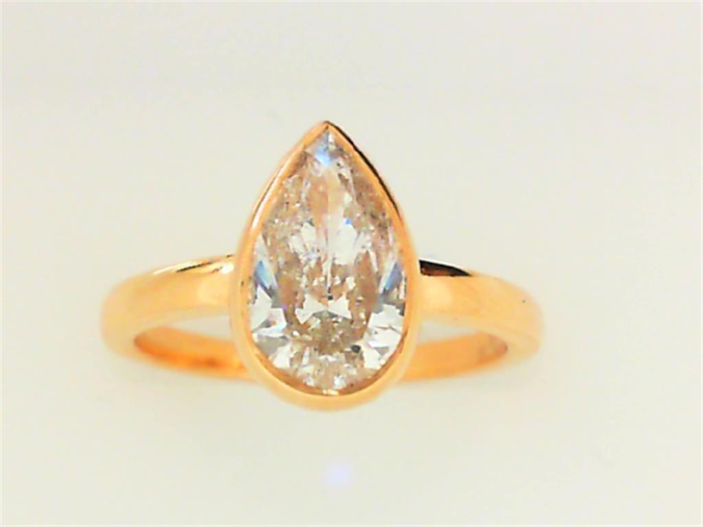 Pear shaped diamond engagement gold ring