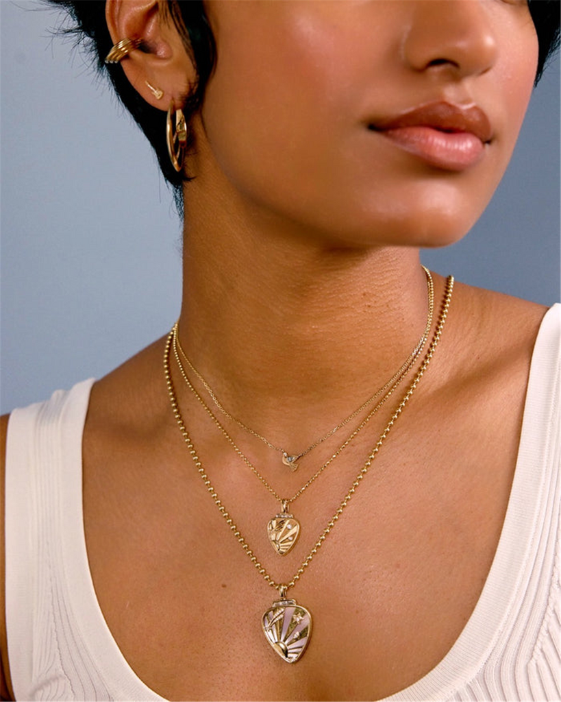 model wearing guitar stud earrings