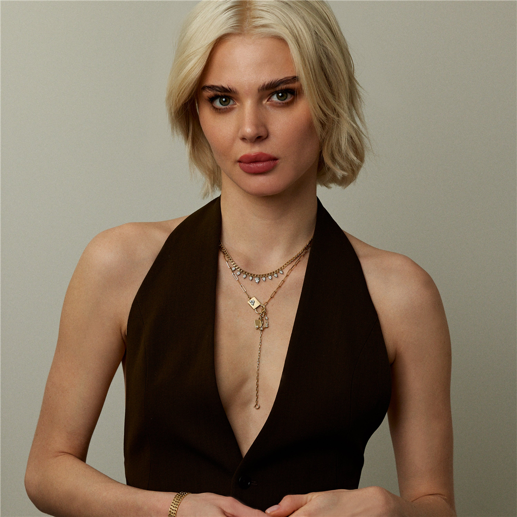 model wearing gold and diamond lariat  necklace