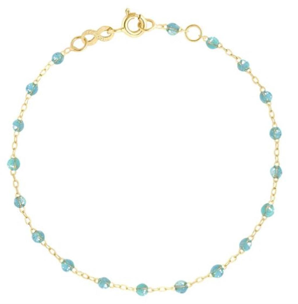dainty gold bracelet with aqua beads
