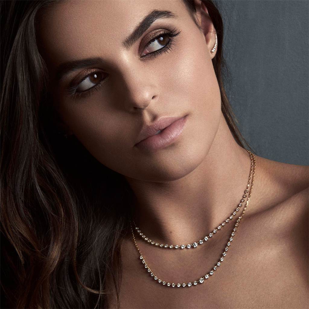 model wearing  diamond neclkaces