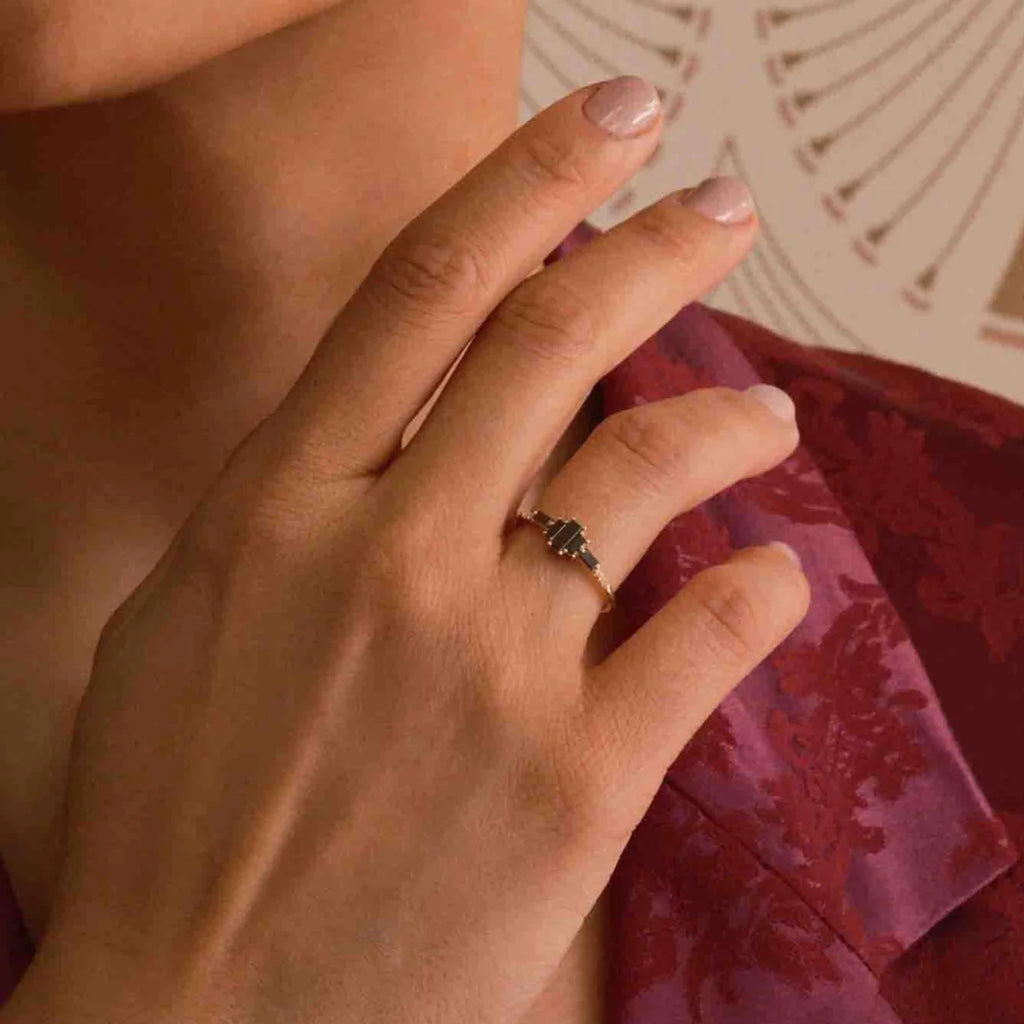 model wearing black diamond ring